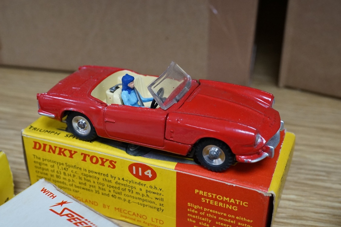 Four boxed Dinky Toys cars; a Triumph Spitfire (114) in red with cream interior, together with three Speedwheels; a Matra 630 (200) in blue, a Ferrari 312P (204) in metallic red, and a McLaren M8A Can Am (223) in white a